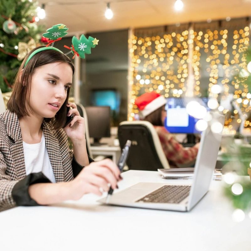 young-contemporary-businesswoman-with-mobile-phone-organizing-work-in-office.jpg